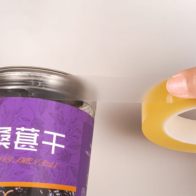 Warehouse packing station using PVC tape for heavy cartons